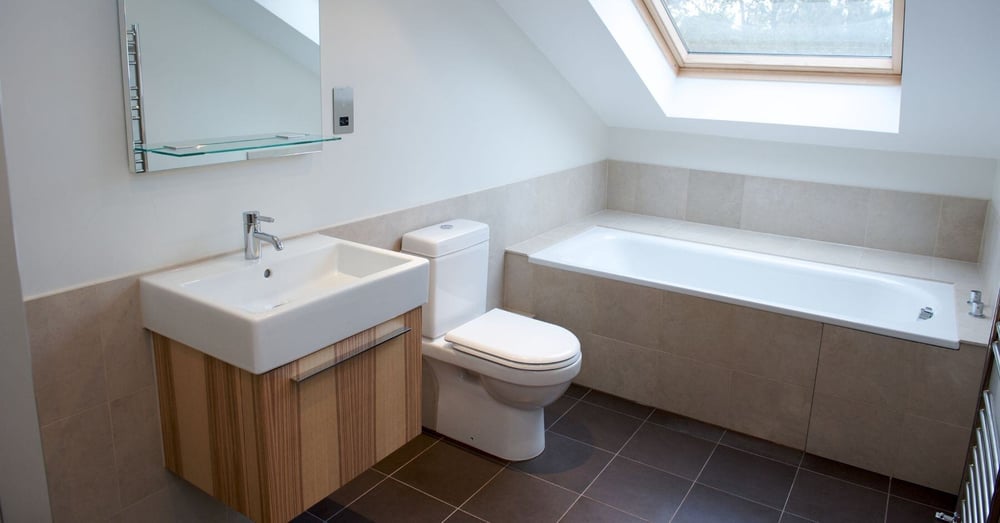 Bathroom in attic conversion with tub and vanity