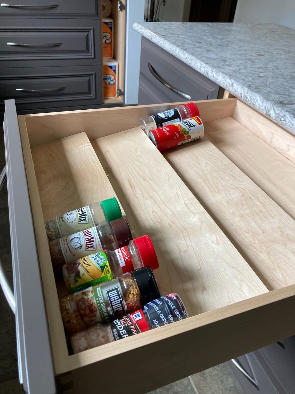 Custom pull-out spice drawer in kitchen island