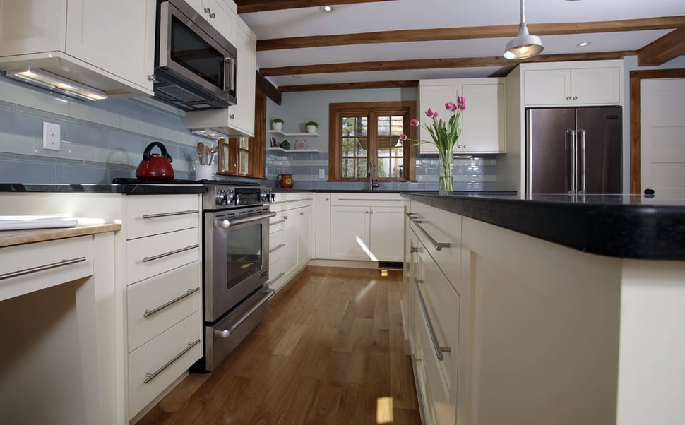 Custom white cabinets in NH kitchen remodel with D-shaped pulls