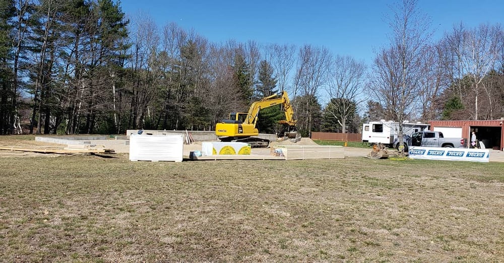 Excavator on new home construction site in New Hampshire