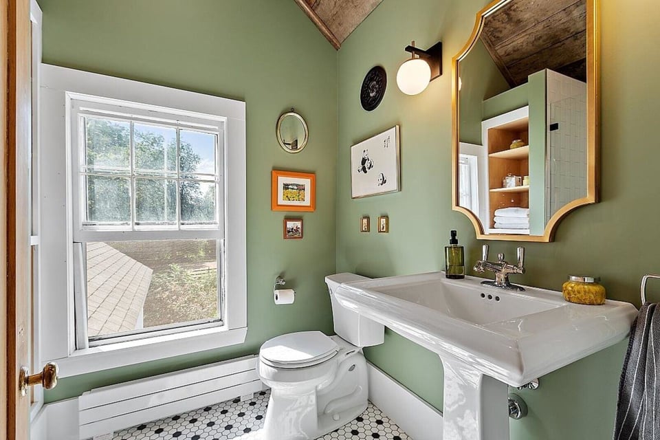 Modern bathroom design with an elegant white and grey palette, completed by Oxland Builders in New Hampshire