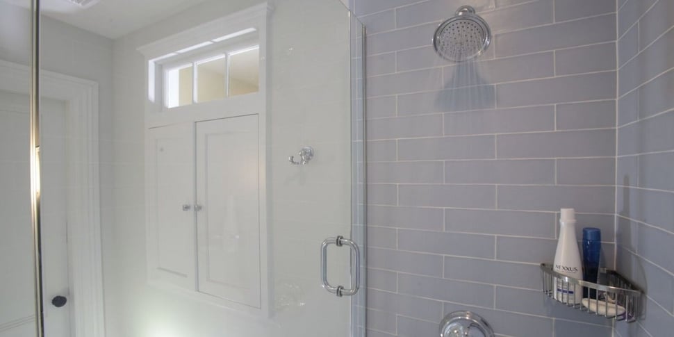 Seacoast bathroom shower head with subway tiling