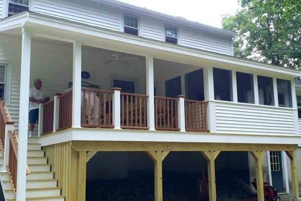 custom built house with a porch patio in new hampshire