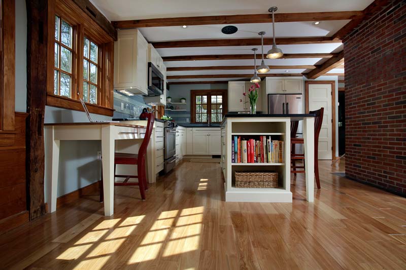 Kitchen remodel in Seacoast, New Hampshire with wood flooring and ceiling beams