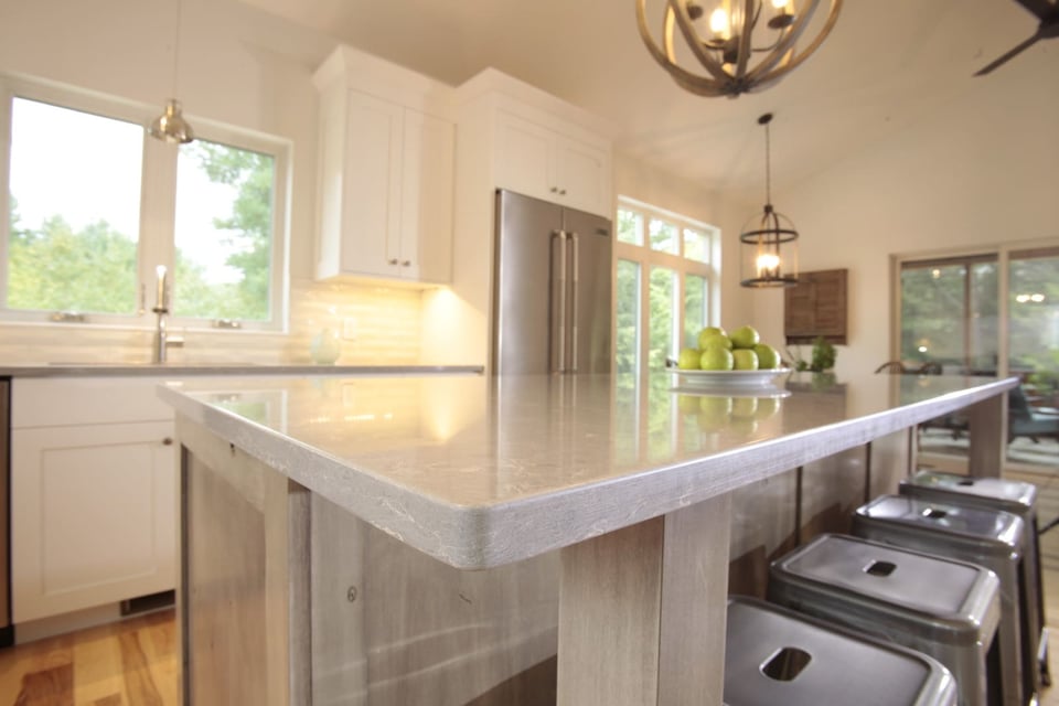 Lovely countertops on New Hampshire kitchen island with stool seating