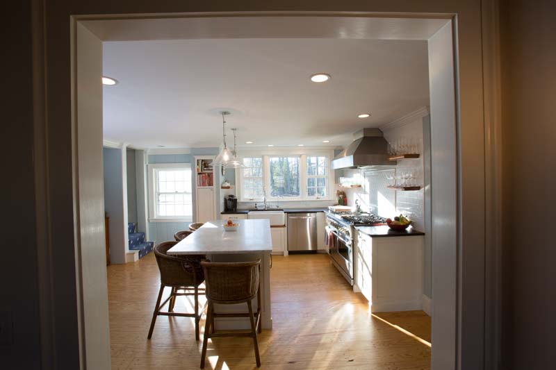 View of L-shaped kitchen remodel in New Hampshire by Oxland Builders