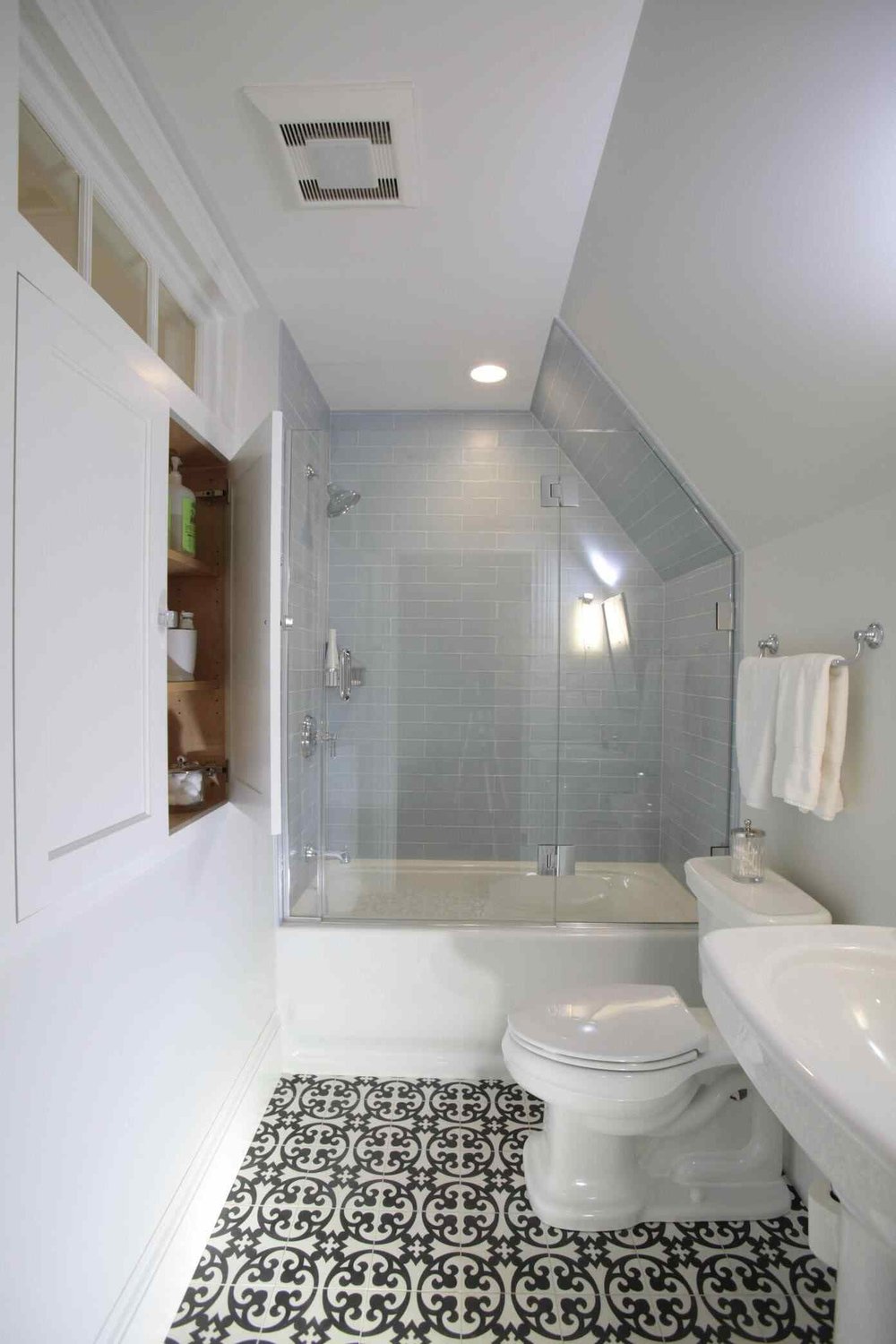 View of tub and shower combo with glass partition