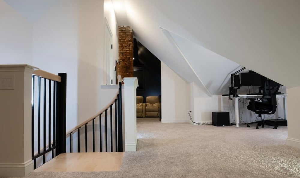 Top of curved staircase to finished attic with office space in Portsmouth remodel by Oxland Builders