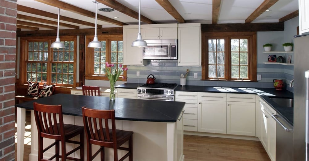 Black countertops in L-shaped kitchen remodel