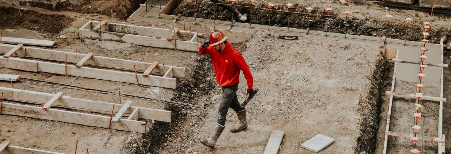 contractor worker walking away from paving