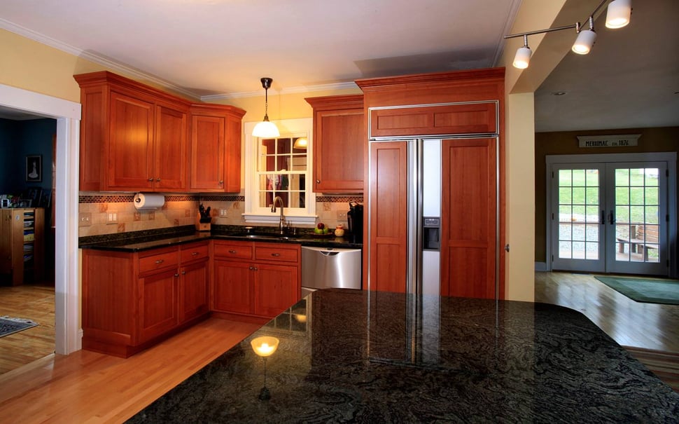 Countertops in kitchen remodel with wood shaker cabinets