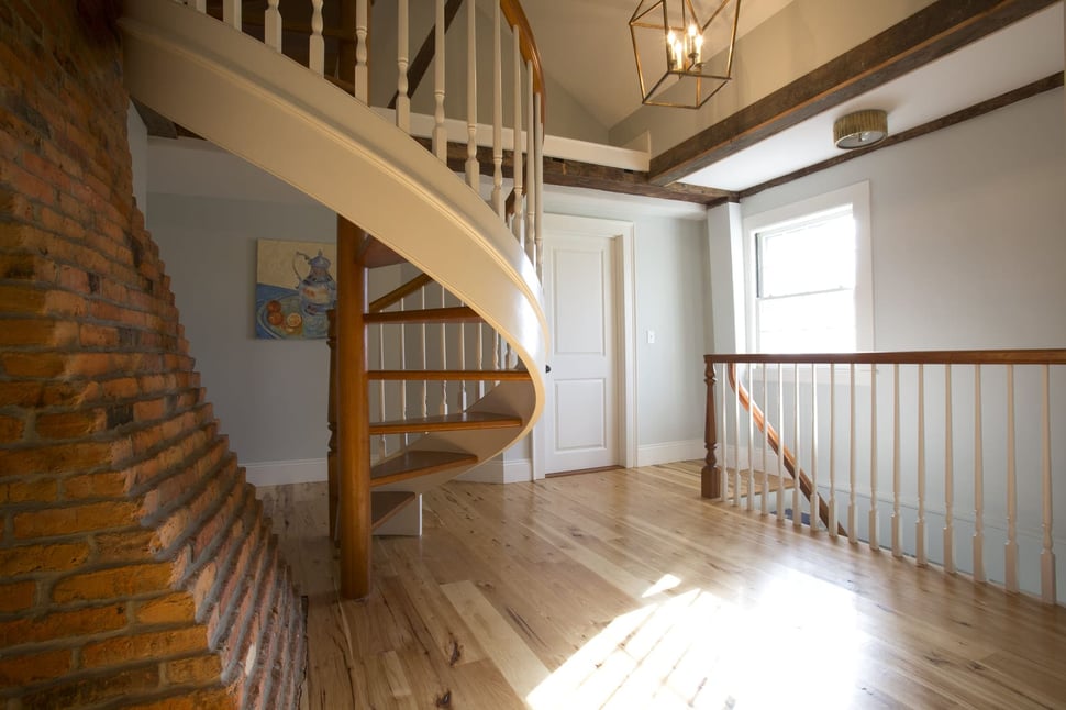 Custom curved staircase in second story of home