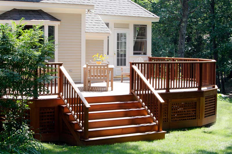 Home addition in backyard with custom deck